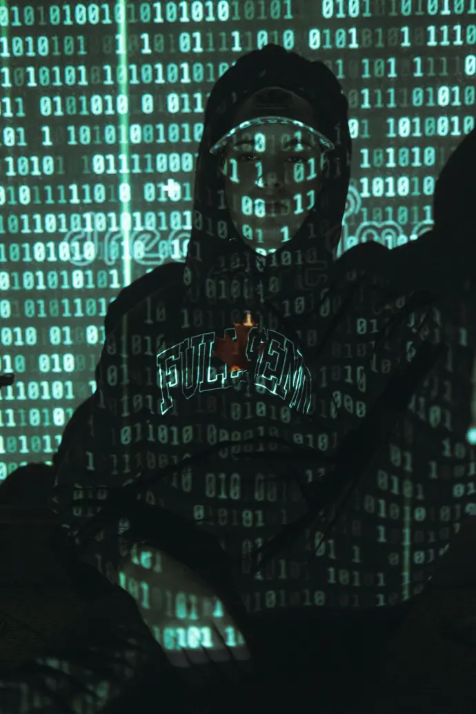 man in black hoodie wearing black framed eyeglasses